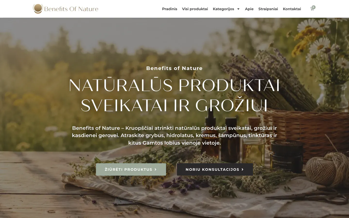 Benefits of Nature homepage with dried herbs, wildflowers and amber bottles on a rustic table and the heading Natūralūs produktai sveikatai ir grožiui (natural products for health and beauty)