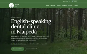 Miško Klinika homepage in English with a forest photo, the heading English-speaking dental clinic in Klaipėda and consultation and services buttons