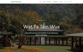 Wat Pa Tam Wua homepage with a monastery pavilion among flowering trees and the heading Wat Pa Tam Wua